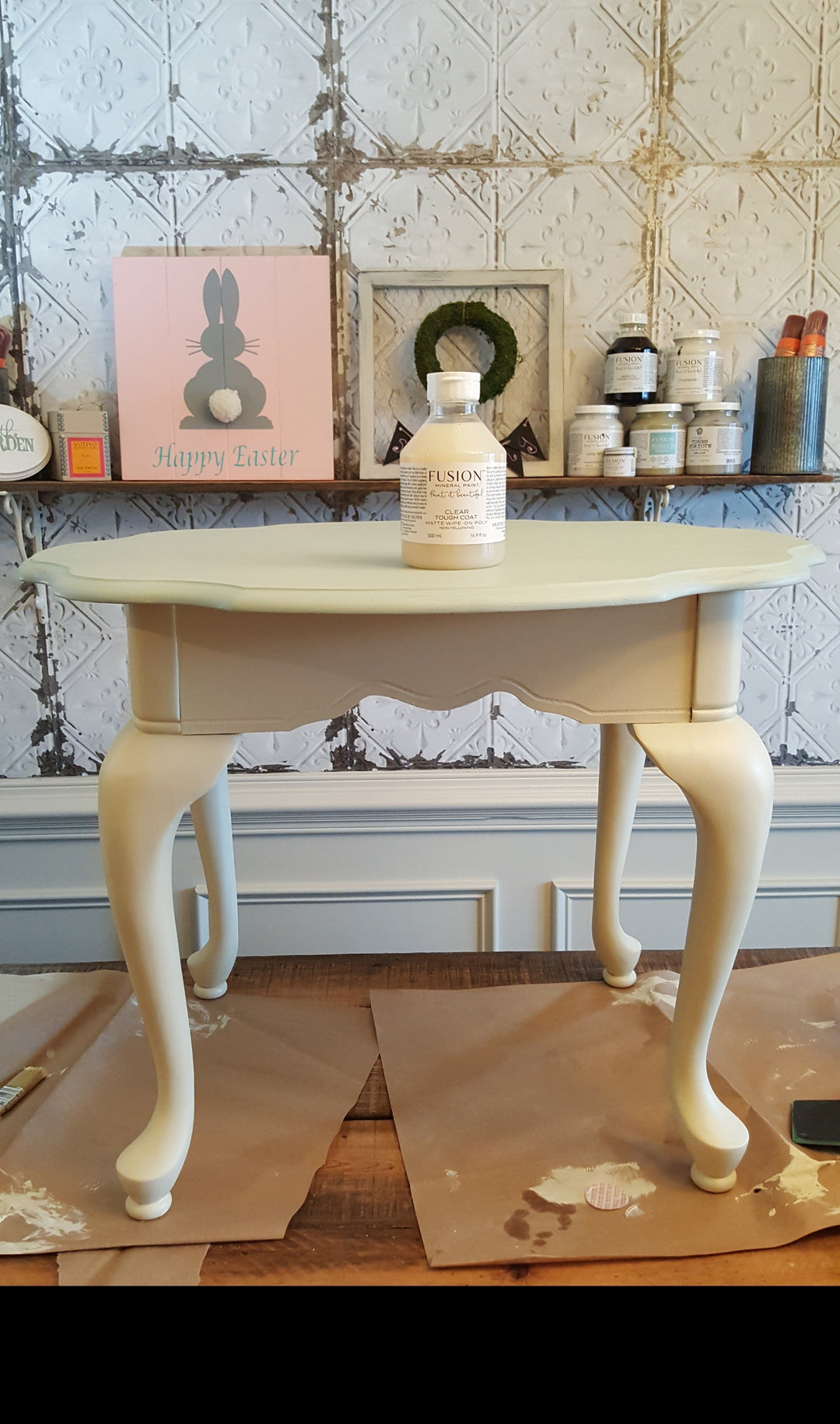 Once shiny table painted in a light blue and cream