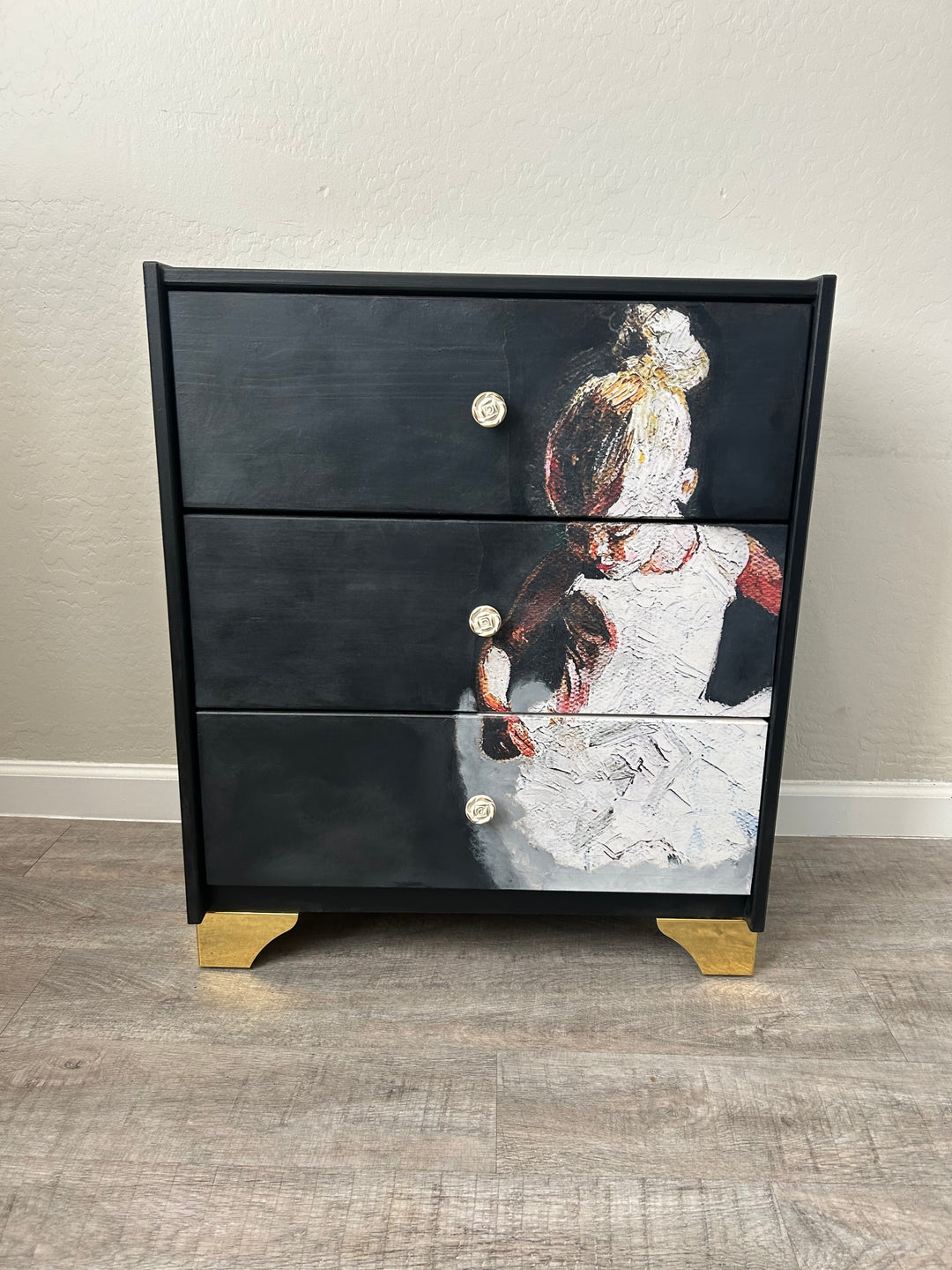 One-of-a-kind black statement dresser with custom painted finish and dramatic drawer interiors, styled as a bold accent furniture piece