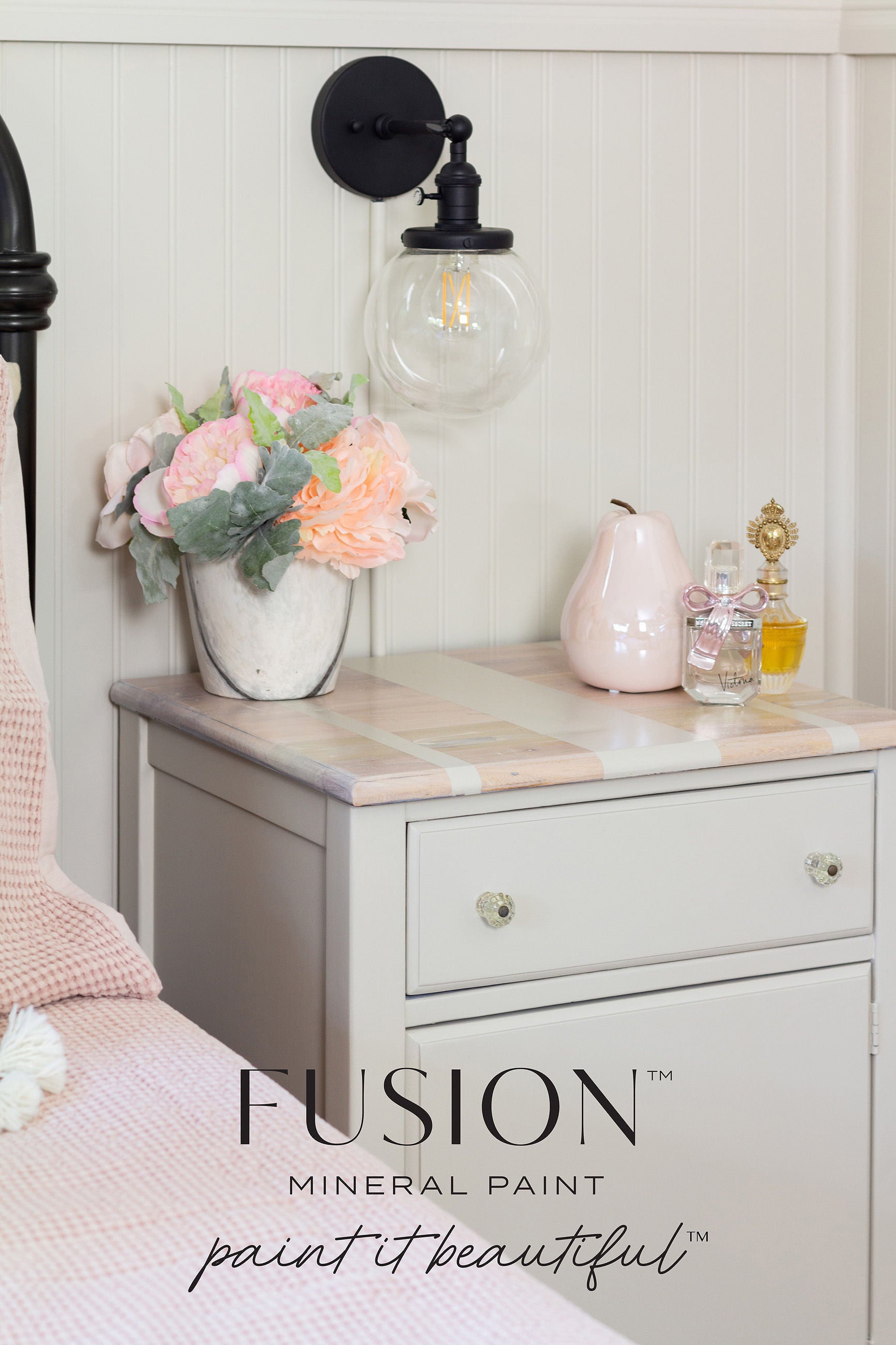 Night stand in color Chateau with a flower pot  and perfumes sitting on top of night stand