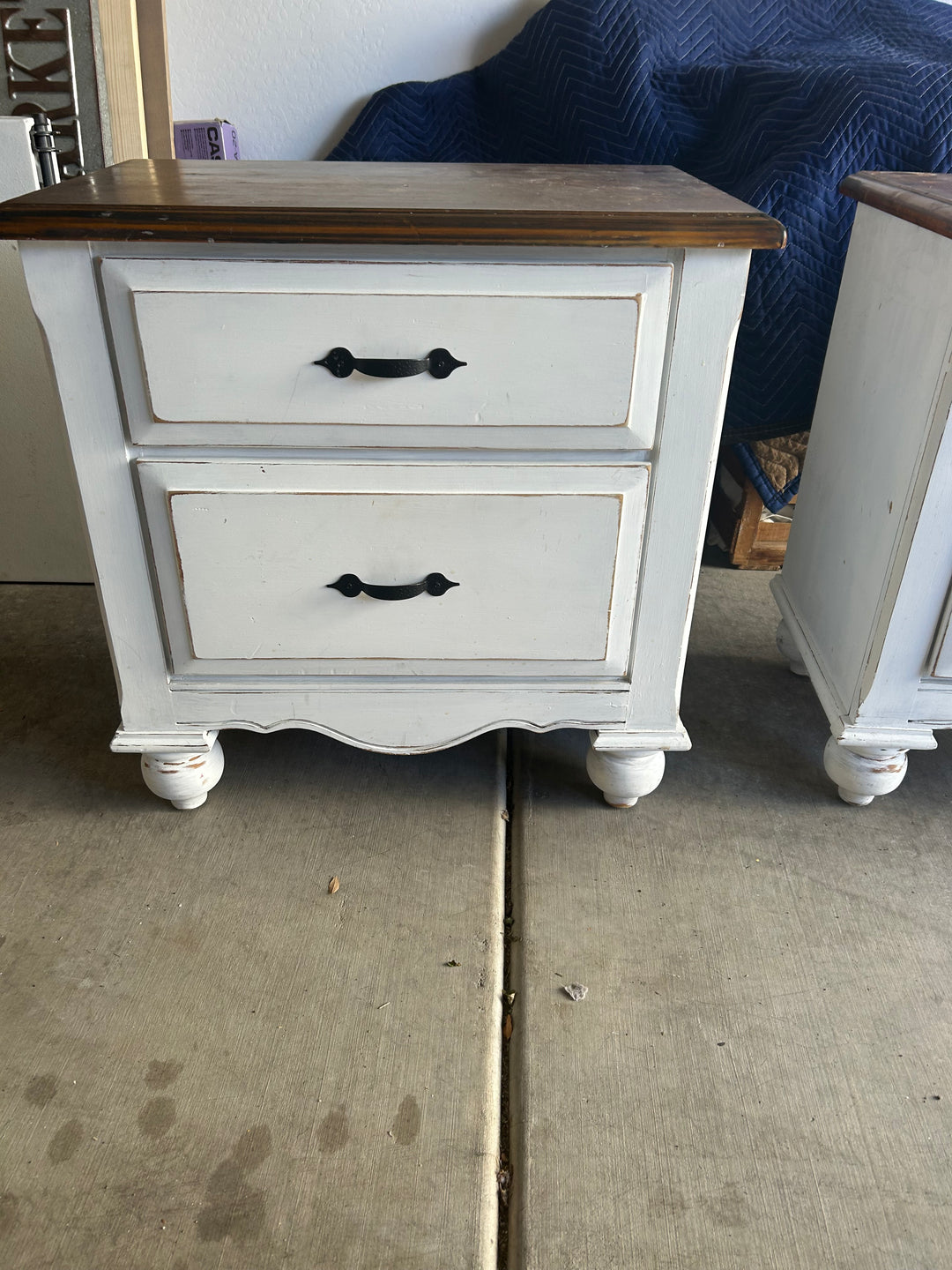 Single nightstand from a matching pair, featuring classic lines and drawer hardware prior to custom paint application