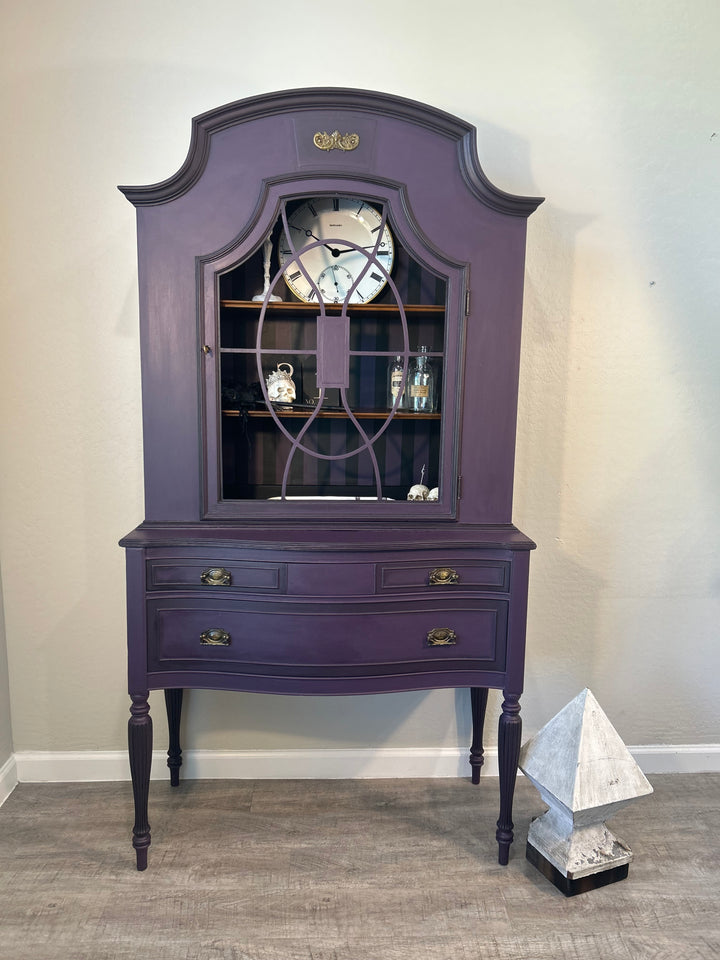 One-of-a-kind moody statement hutch painted in a rich dark finish, designed as functional art for a curated interior